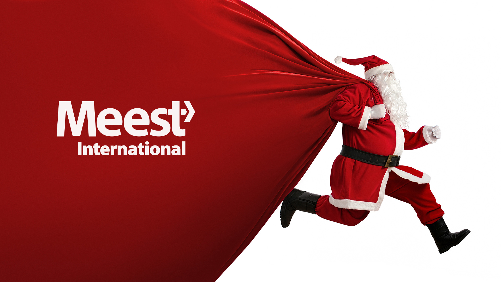 Santa Claus holding a gift box while smiling in front of a festive background, symbolizing holiday eCommerce success.